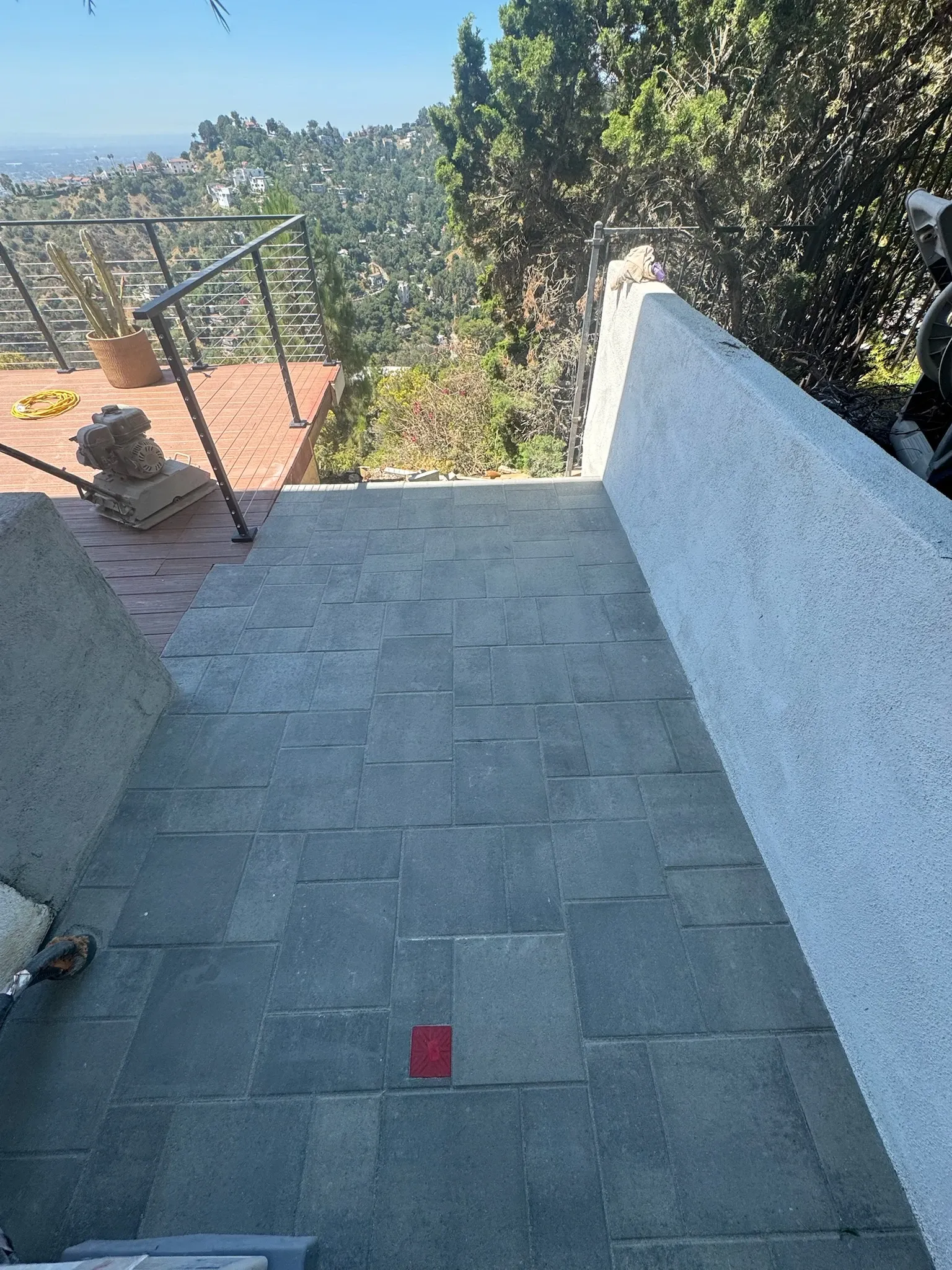 Hillside patio with large-format concrete pavers